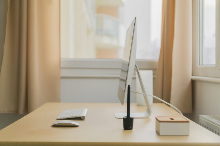 The desktop, keyboard, and mouse are neatly arranged on the desk.
